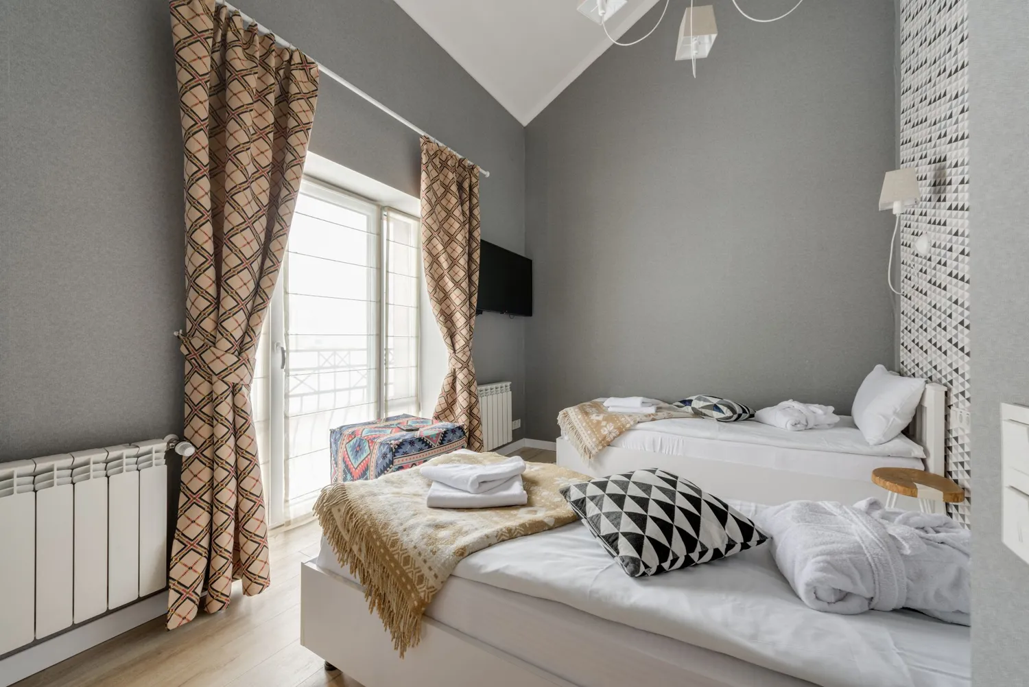 A clean guest bedroom with fresh bedding, ready for arrival